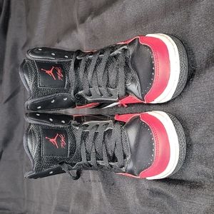 Jordan Flight sneakers. Used w/large crease in left shoe. Good condition